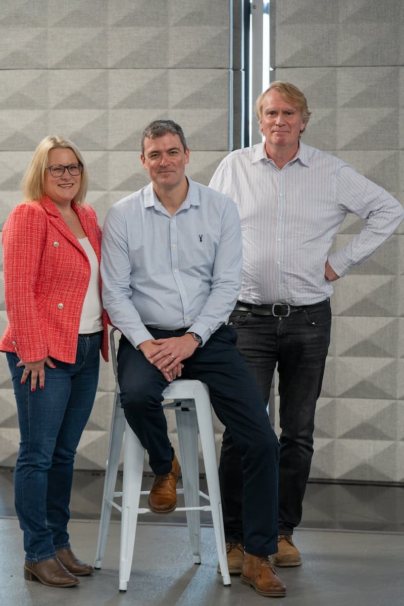 Managing Partner elect, Sarah Walton, standing next to current Senior Partner, Peter Wake, and current Managing Partner, John Schorah.